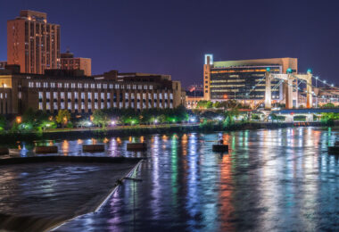 The Mississippi River in Downtown Minneapolis United States Post Office, Hennepin Ave Bridge and United States Federal Reserve also pictured.