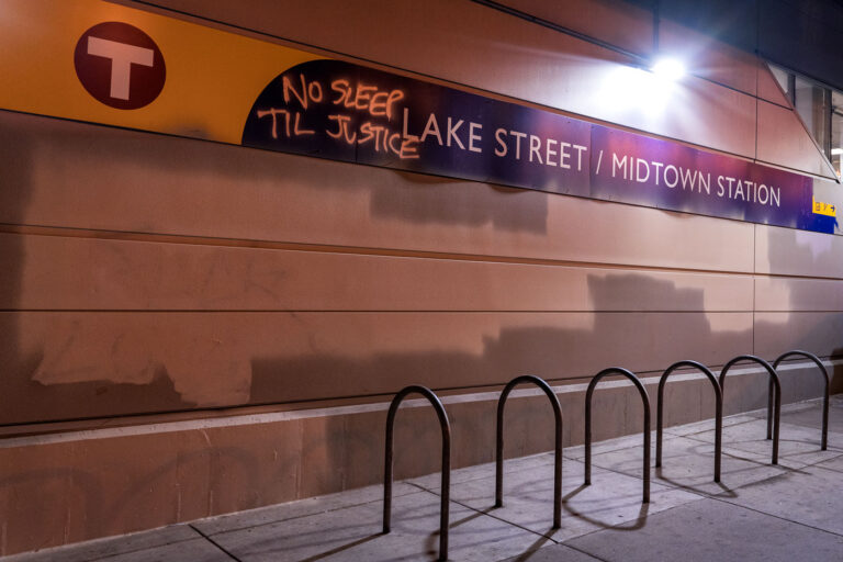 No Sleep Till Justice at Lake Street Station 1 Graffiti reading No Sleep Til Justice on the Lake Street/Midtown Station signage in South Minneapolis.