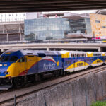 Northstar Train at Target Field Station, Minneapolis 4 The Northstar Train at the Target Field Station in Minneapolis. Above is Target Field, home of the Minnesota Twins MLB baseball team. COVID-19 warnings scroll on the digital board.