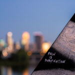 "Pain is Purification" on a train bridge in North Minneapolis.