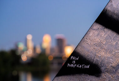 "Pain is Purification" on a train bridge in North Minneapolis.