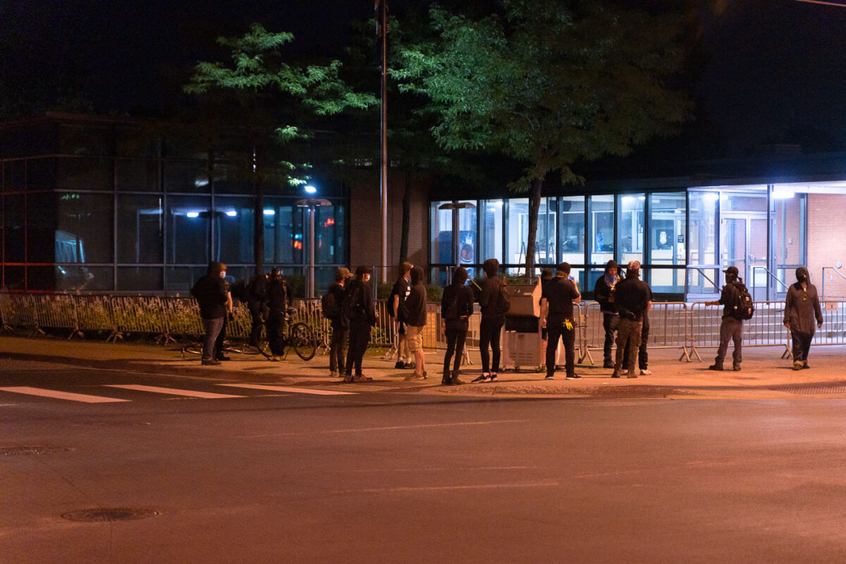 Protesters gather to grill hot dogs outside the Minneapolis Police Fifth Precinct on August 16, 2020.