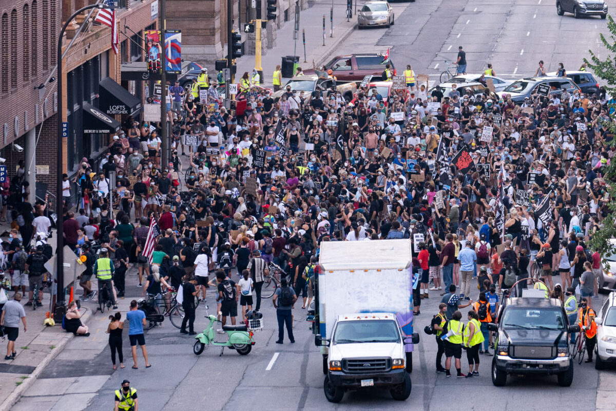 Protesters march in downtown Minneapolis outside the Minneapolis Police 1st precinct police station demanding justice for Jacob Blake who was shot by Kenosha Police.