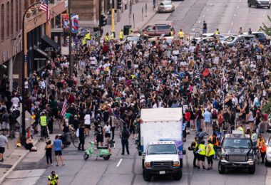 Protesters march in downtown Minneapolis outside the Minneapolis Police 1st precinct police station demanding justice for Jacob Blake who was shot by Kenosha Police.