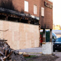 A Minneapolis Police Officer stands guard at the former Wells Fargo Bank in Minneapolis. The building was burned during protests following the May 25th, 2020 death of George Floyd. The security was 24/7 while the bank looked for a way to safely allow people into the building to retrieve the items in their safety deposit boxes.