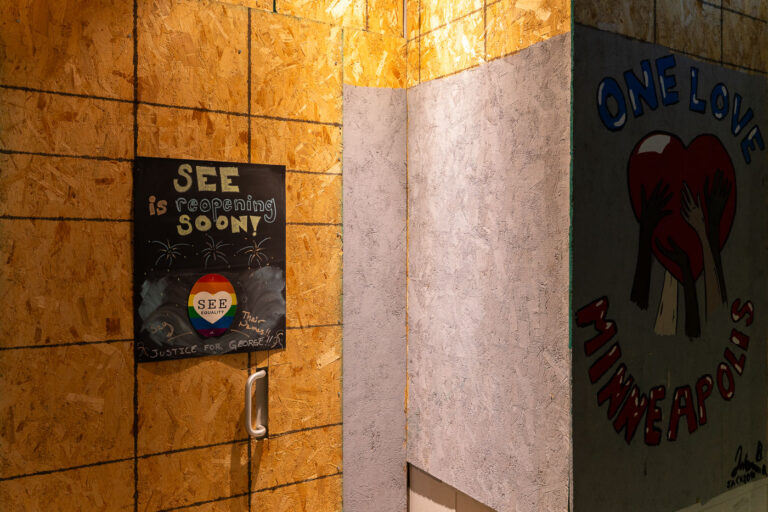 SEE store is re-opening soon 1 SEE retail store with boards and a sign announcing their re-opening in August 24, 2020.