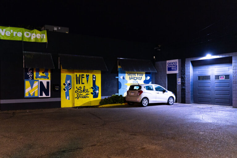 We Love Lake Street 3 The Master Collision store on West Lake Street with boarded windows and murals after unrest in Minneapolis over the killing of George Floyd.