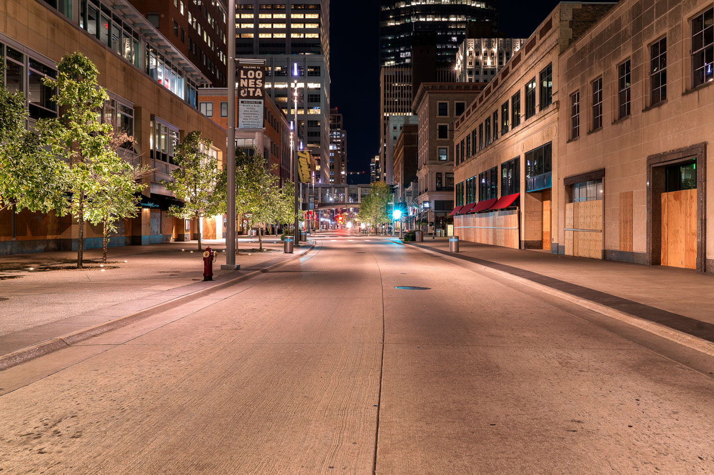 An empty Nicollet Mall with boarded windows