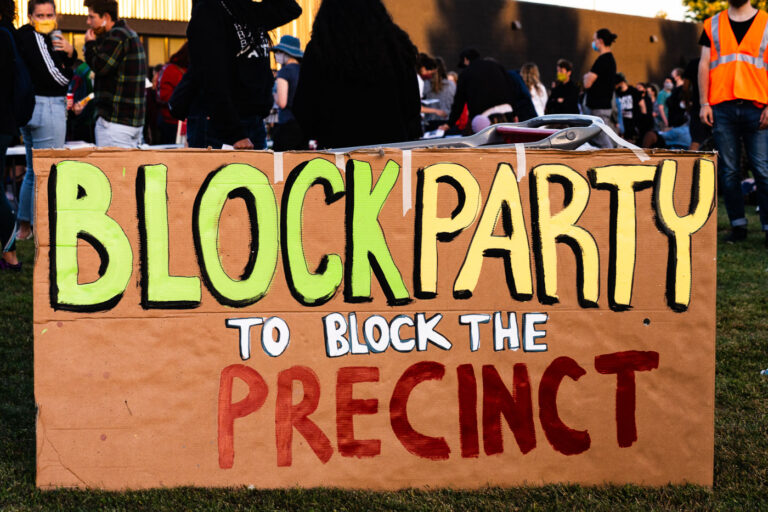 Protesters hold Block part to block new police station 1 Protesters gather at a "Block Party to Block the Precinct" protest to bring awareness and block any potential lease for a new 3rd precinct. The 3rd precinct police station, located a mile away, was burned by protesters after the May 25th, 2020 death of George Floyd.