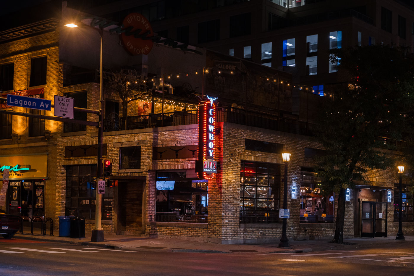 Cowboy Slims sign lit up at intersection