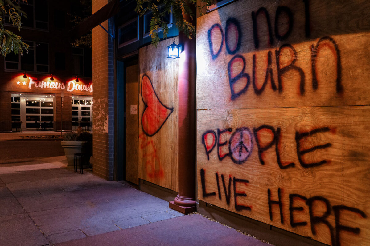 Boards on Lake Street in Minneapolis that read "Do Not Burn" and "People Live Here”. The boards appeared following the the May 25th, 2020 death of George Floyd.