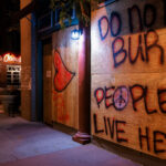 Boards on Lake Street in Minneapolis that read "Do Not Burn" and "People Live Here”. The boards appeared following the the May 25th, 2020 death of George Floyd.
