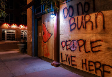 Boards on Lake Street in Minneapolis that read "Do Not Burn" and "People Live Here”. The boards appeared following the the May 25th, 2020 death of George Floyd.