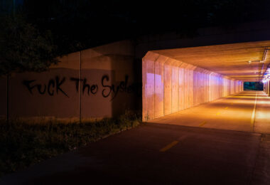 "Fuck The System" written on a bike trail near downtown Minneapolis.