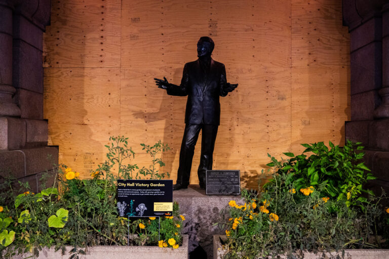 Hubert Humphrey statue and boarded windows 2 The "City Hall Victory Garden" with boarded up windows.