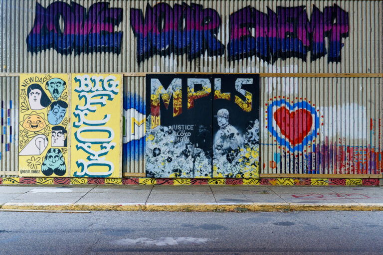 Love Your Enemy graffiti 1 Painted boards on the former K-Mart in South Minneapolis.
