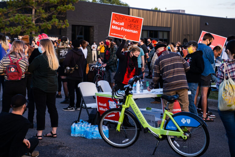 Recall Mike Freeman 2 A woman taking signatures for the Recall Mike Freeman campaign. Mike Freeman is the Hennepin County Attorney.