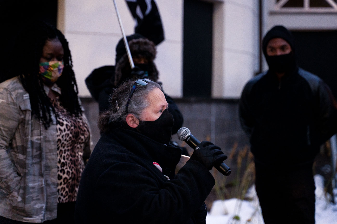 Michelle Gross speaks outside the 4th precinct police station