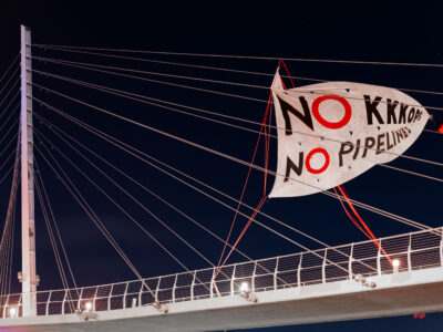 Protest Banner: No KKKops No Pipelines on Martin Olav Sabo Bridge