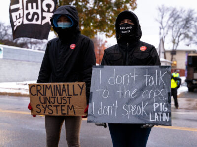Protesters with anti-police brutality signs, Minneapolis 4th Precinct