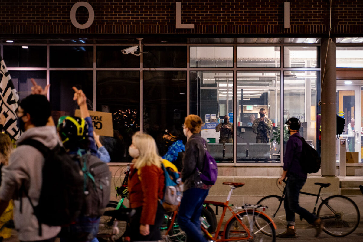 Protesters march past the Minneapolis First Precinct the day after former Minneapolis Police Officer Derek Chauvin was released on bond. Chauvin has been charged in the May 25th death of George Floyd.