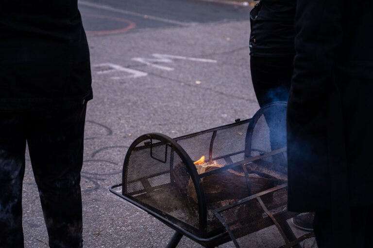 Protesters warm hands at George Floyd Square 4 Those at the square keep themselves warm with a fire.