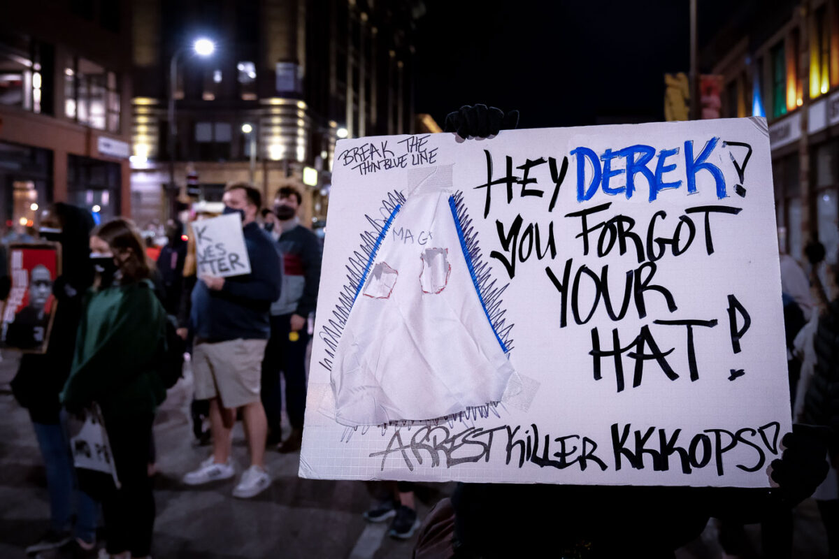 A protest sign held up the day after former Minneapolis Police Officer Derek Chauvin was released on bond, protesters march to the First Precinct in downtown Minneapolis.