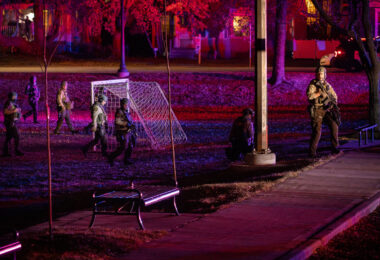 Minneapolis Police, Park Police and Hennepin County Sheriff officers arrest 14 after a march through Uptown Minneapolis on Election Night.