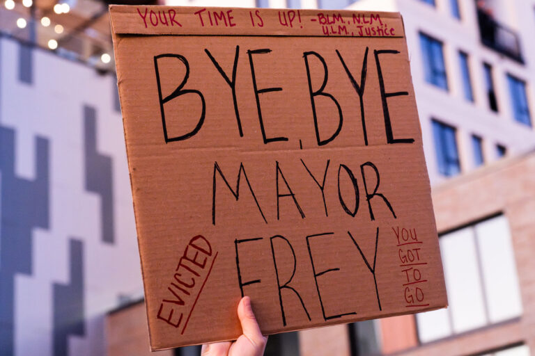 Bye, Bye, Mayor Frey 4 Protester outside Minneapolis Mayor Jacob Frey’s home holds up a sign that reads “Your time is up! Bye, Bye Mayor Frey. Evicted”. Protesters demanding the mayor do something about homelessness in the city.