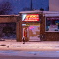 Hop Wong Chinese Restaurant on Chicago Ave in Midtown Minneapolis during a heavy snowfall.