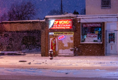 Hop Wong Chinese Restaurant on Chicago Ave in Midtown Minneapolis during a heavy snowfall.