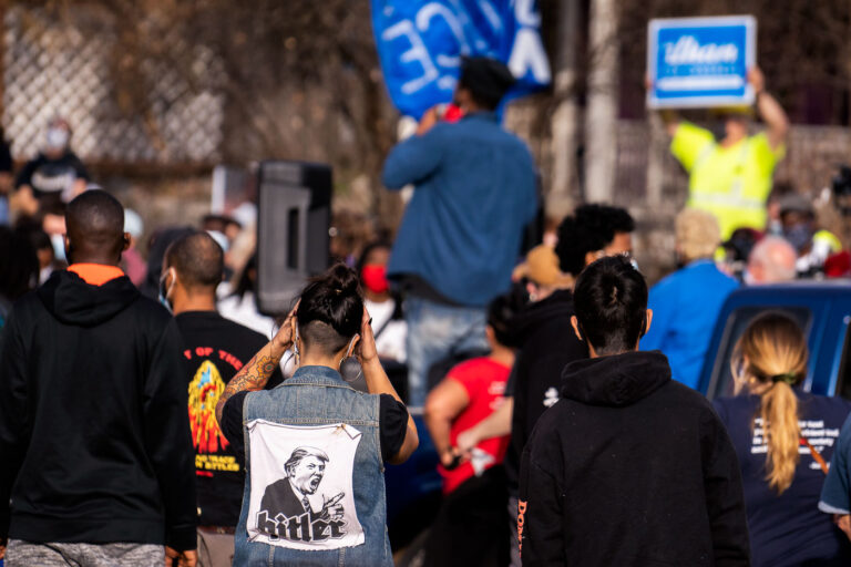 Hitler/Trump patch on protesters back 1 Protester with a large Hitler/Trump patch on her back following a march through Minneapolis after Biden was announced winner of the Presidential election.