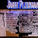Art on boards covering the John Fluevog store on Hennepin Ave and Lagoon Ave in Uptown Minneapolis.