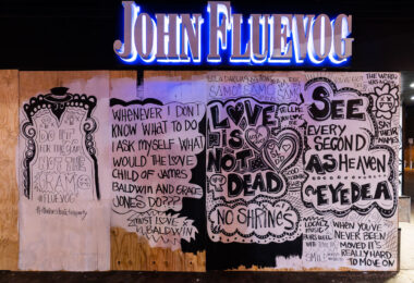 Art on boards covering the John Fluevog store on Hennepin Ave and Lagoon Ave in Uptown Minneapolis.