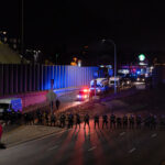 Minnesota State Patrol form a line across Interstate 94 in Minneapolis prior to arrest 646 who had been marching on the night after the election down the freeway.