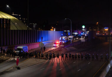 Minnesota State Patrol form a line across Interstate 94 in Minneapolis prior to arrest 646 who had been marching on the night after the election down the freeway.