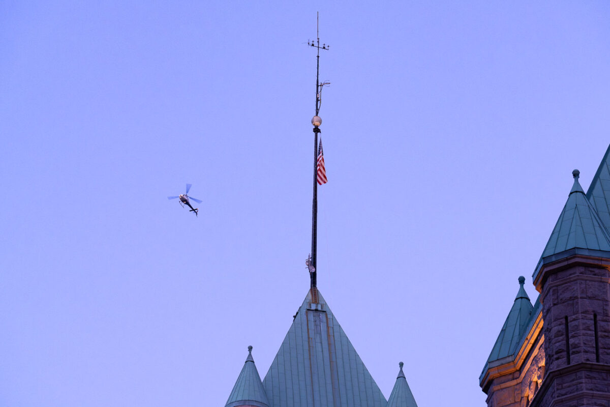 A news helicopter over Minneapolis City Hall in Downtown Minneapolis.