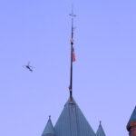 A news helicopter over Minneapolis City Hall in Downtown Minneapolis.