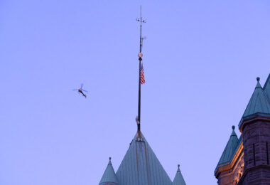 A news helicopter over Minneapolis City Hall in Downtown Minneapolis.
