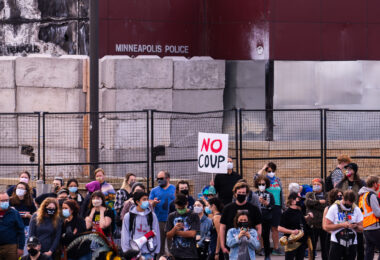 Protesters gather outside of the Minneapolis Police Third Precinct as part of a march shortly after Biden was announced as winner of the Presidential election.