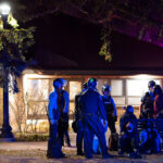 Minneapolis Police, Park Police and Hennepin County Sheriff officers arrest 14 after an election night protest through Uptown Minneapolis.