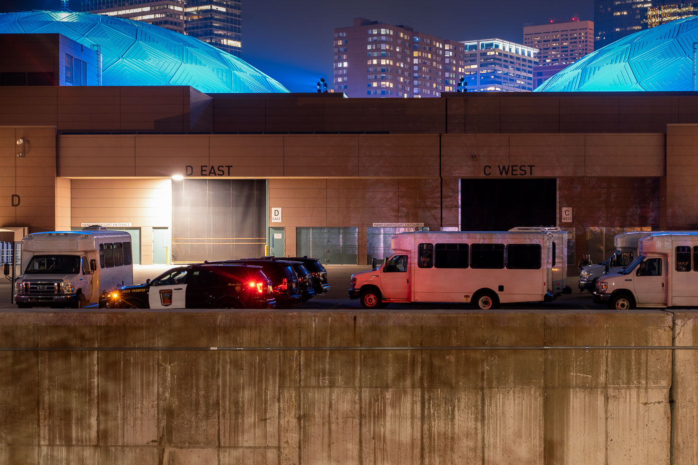 State patrol arrest buses outside convention center.
