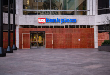 US Bank Plaza in downtown Minneapolis with boards covering the windows.