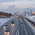 Road construction on interstate 35W in South Minneapolis with the city skyline in the background.