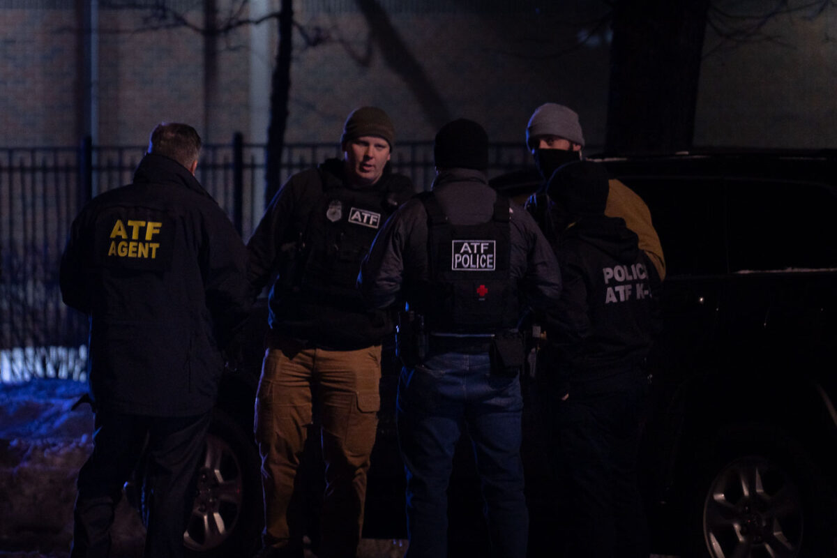 The ATF and DEA gather outside the Holiday Gas station where Dolal Idd was shot and killed by Minneapolis Police on December 31, 2020.
