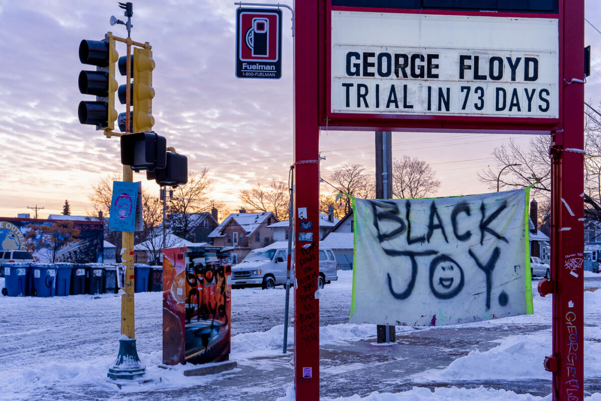 The sun sets to the west of George Floyd Square on the first day of Kwanzaa. Day 1 represents Umoja (Unity). 

The countdown to the Derek Chauvin trial was recently added to what was a Speedway sign. The area has been a protest zone since the May 25th, 2020 death of George Floyd.
