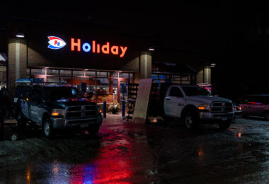 Workers board up windows at Holiday Gas on Cedar Ave in South Minneapolis in preparation for any possible unrest following the Minneapolis Police shooting of Dolal Idd. Earlier in the year George Floyd was killed by Minneapolis police a mile away.