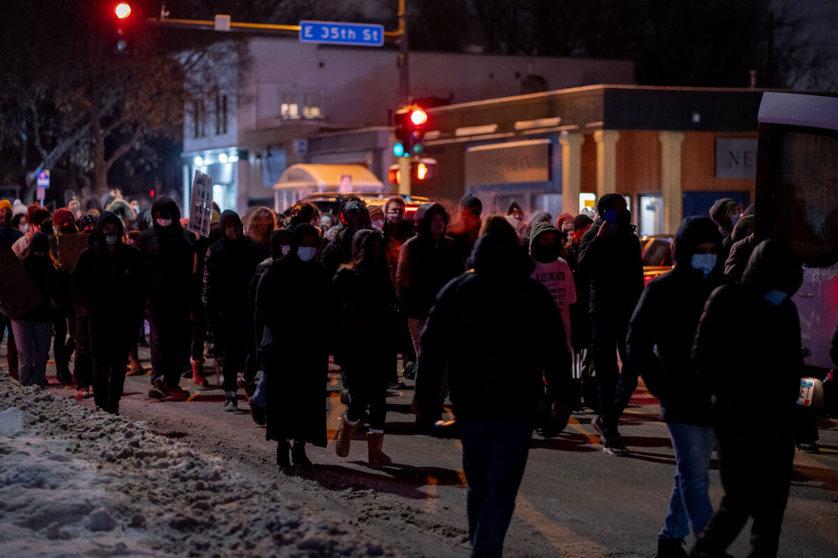 Protesters march down Cedar Ave a night after the Minneapolis police shoot and kill Dolal Idd. Minneapolis Police released video they say showed Dolal Idd shooting first through the window of his car during a firearm sting.