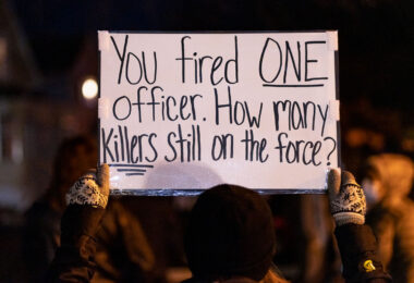 Protesters march down Rice St. a day after police released the body cam footage of a St. Paul police officer shooting a nude unarmed black man who was being attacked by a K9. The officer was fired by the force.
