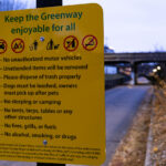 New signs on the greenway that replaced homeless encampment safety notices. The people living along the greenway were evicted on December 17th and 18th.
